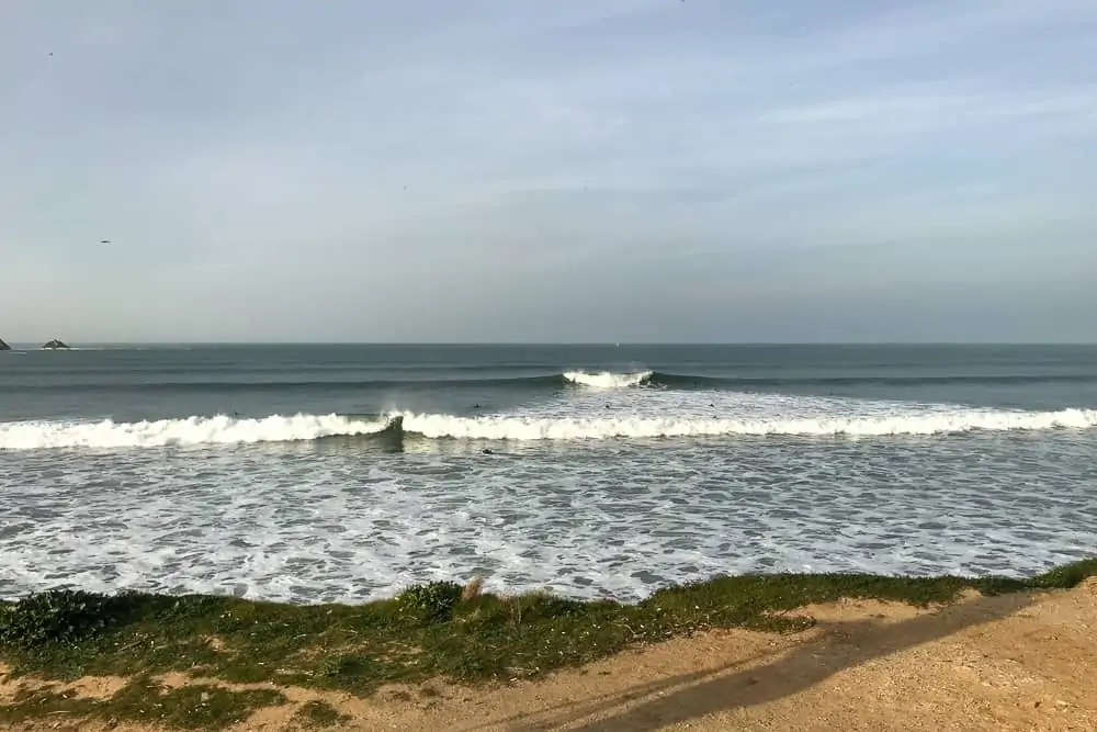 Typical a-frame wave breaking both left and right at the surf spot Lagide in Peniche